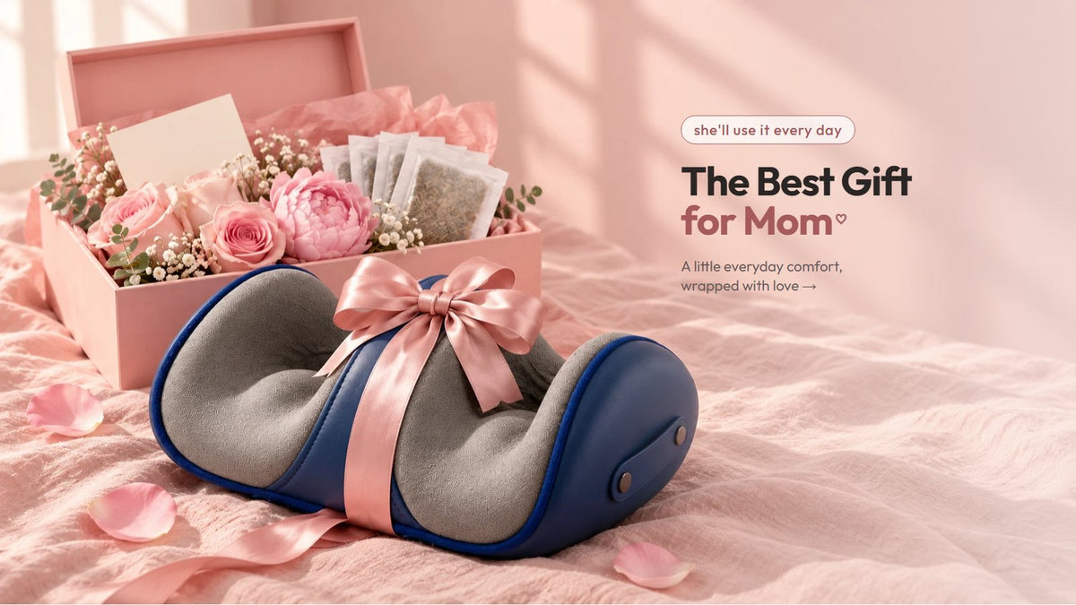 The VIFERA shiatsu foot massager with a pink ribbon in front of a gift box for mom