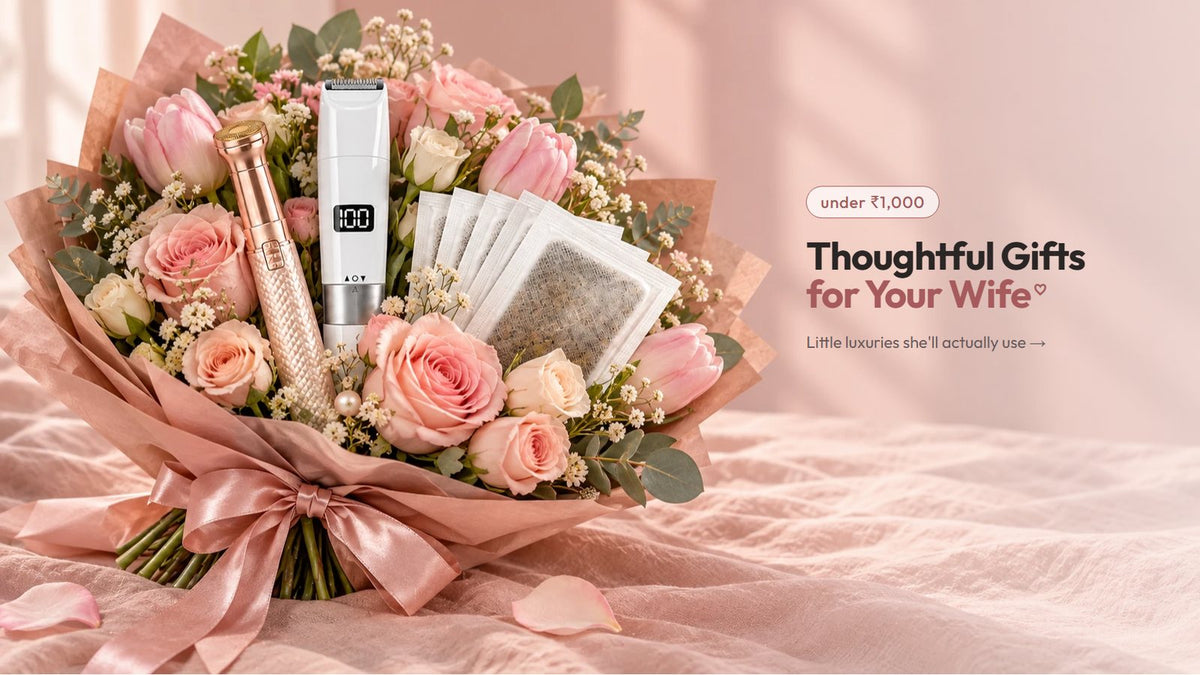 A bouquet of pink roses holding a gold VIFERA 2-in-1 trimmer, the Face & Body Trimmer and foot patches
