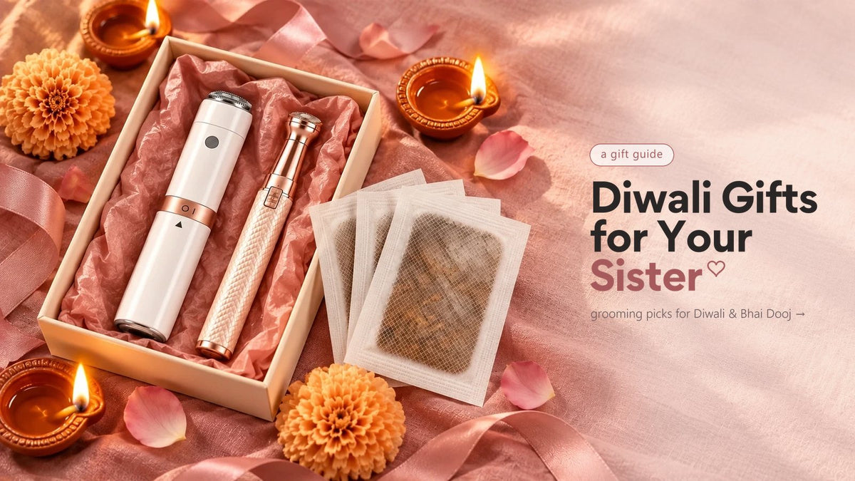 A gift box with the VIFERA grooming pen and the gold 2-in-1 trimmer, herbal foot patches, diyas and marigolds on pink satin